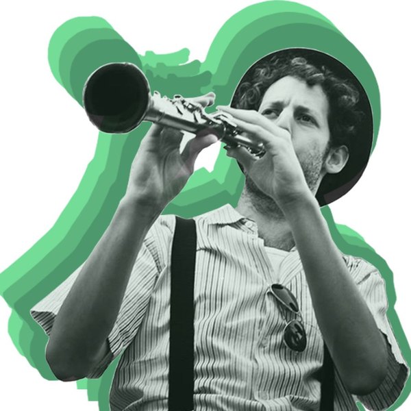 Gal Klein playing clarinet in a hat and suspenders